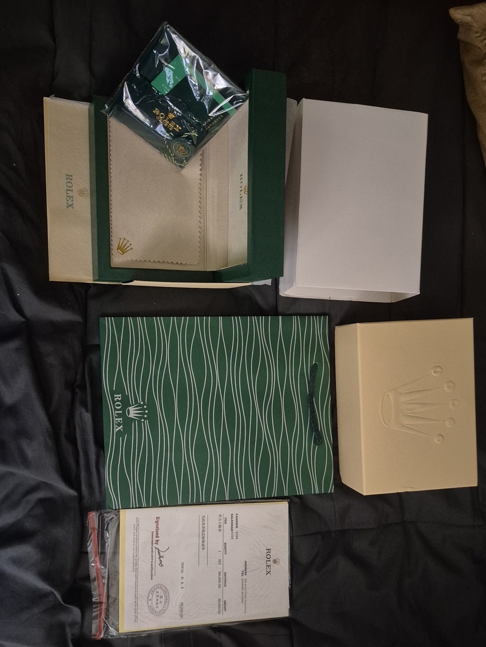 Rolex packaging set in green, cream and white